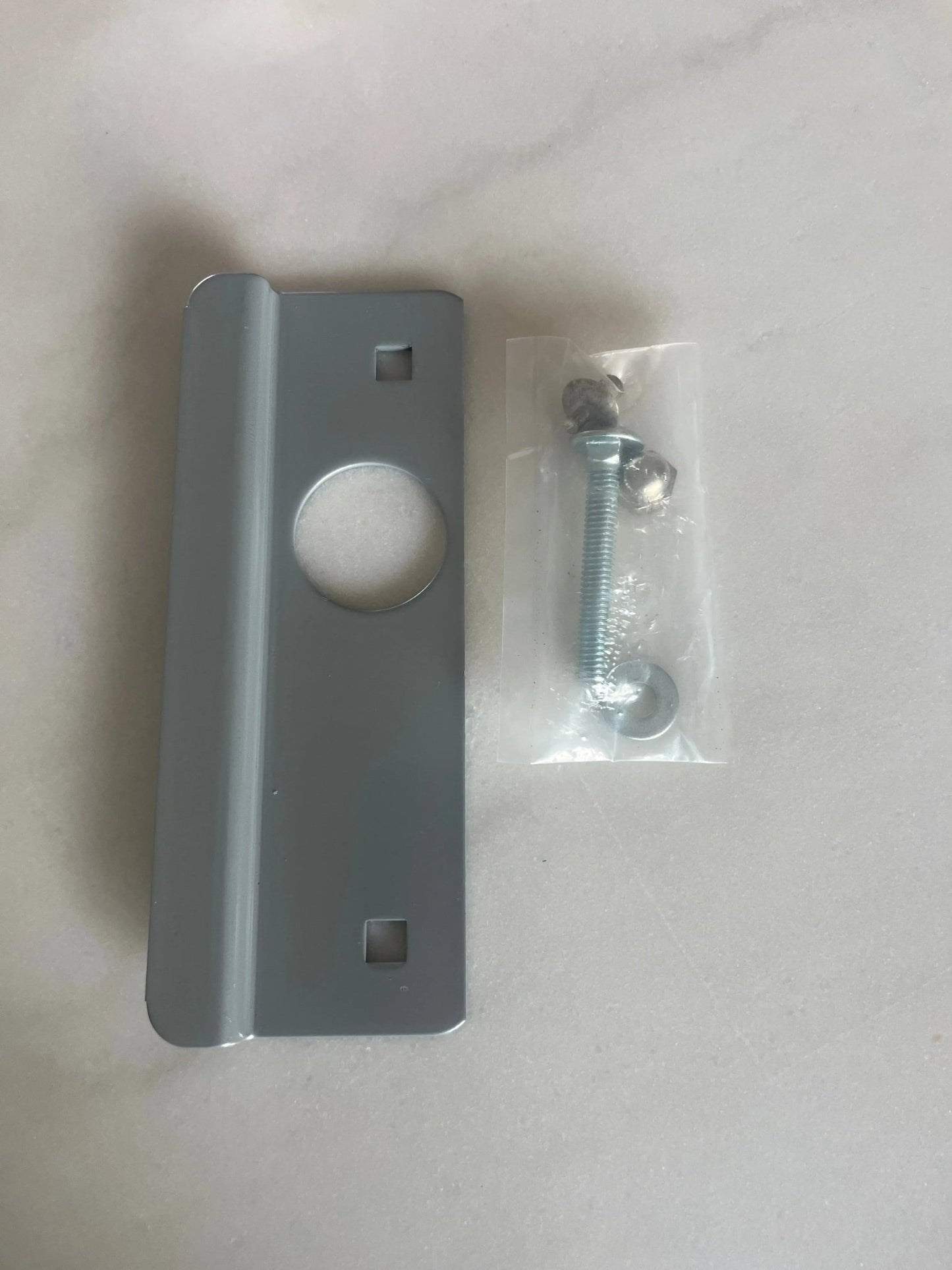 Right-hand Don-Jo electric strike latch guard cover for commercial doors, pry shield that protects the latch and strike area from tampering.